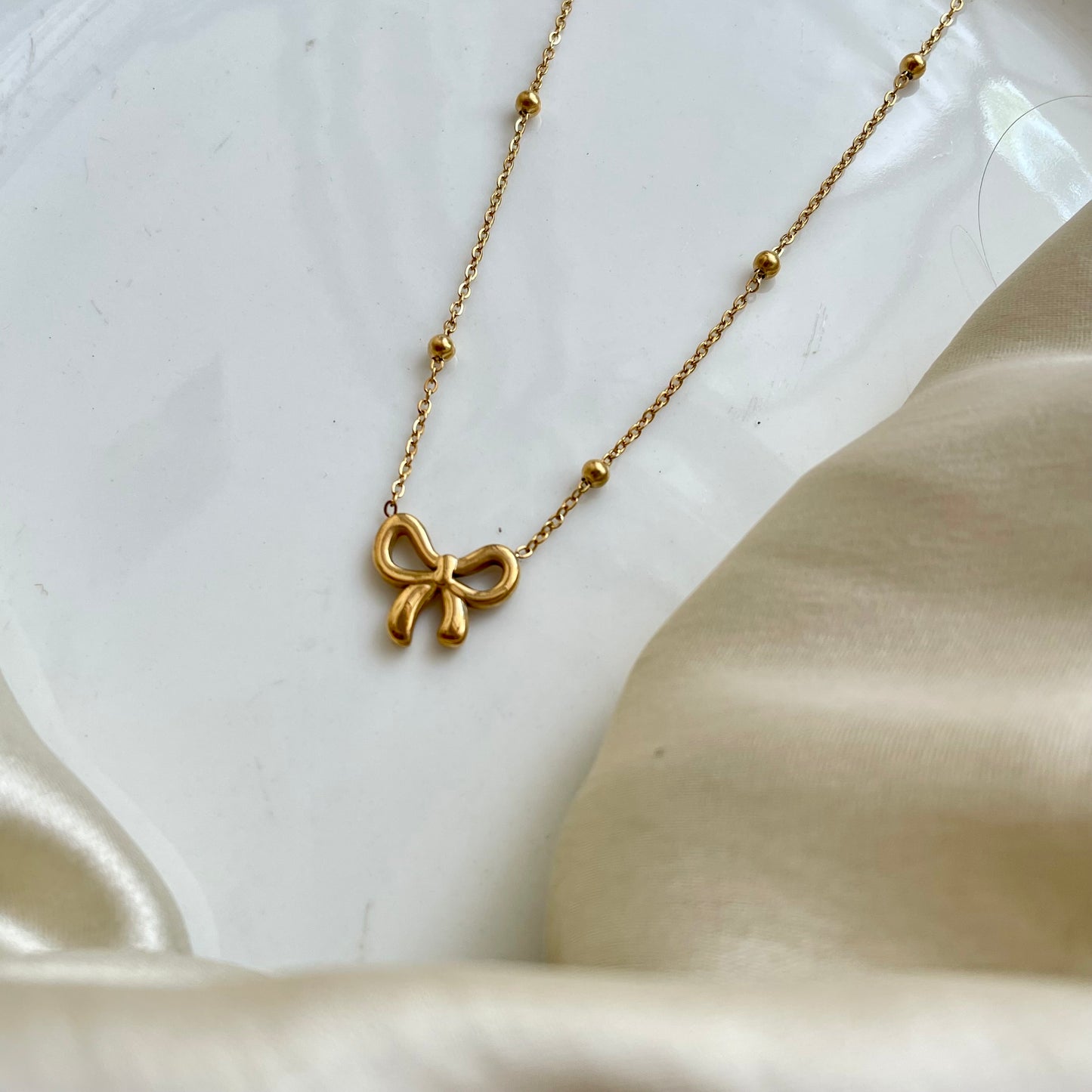 Golden Whisper Bow Necklace